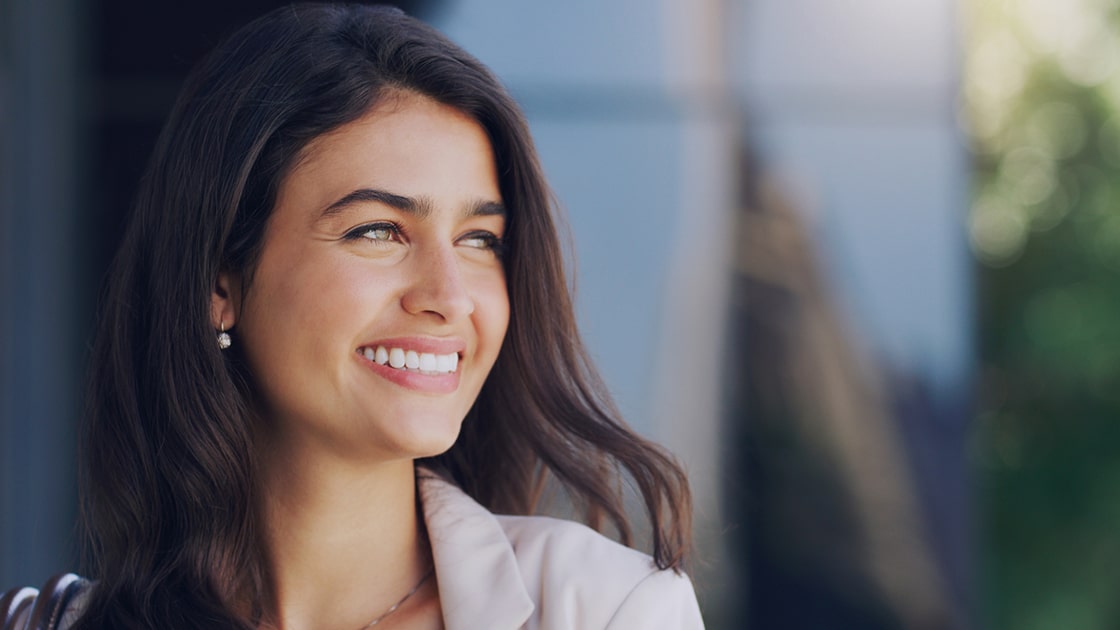 Smiling Woman Outside A Building
