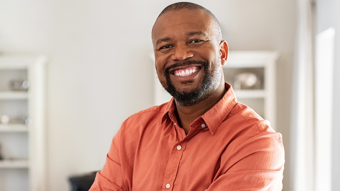 Smiling Man with Orange Shirt