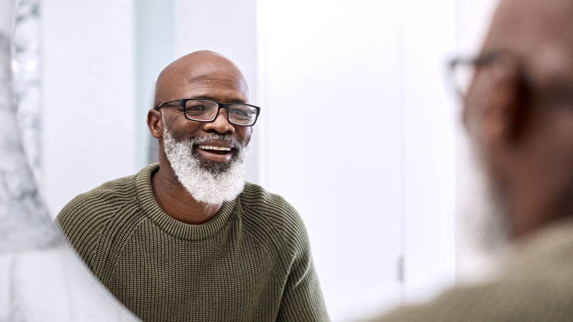 Mature Man Smiling in the Mirror